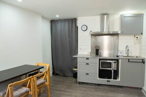Fridge, microwave, stovetop, coffee/tea maker