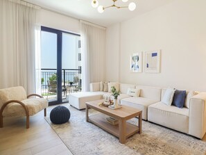 Comfort Apartment | Living area | 55-inch Smart TV with cable channels, Netflix, streaming services - HiGuests - La Rive 2 (Dubai)