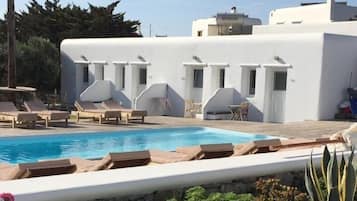 Outdoor pool, open 9:00 AM to 7:00 PM, pool umbrellas, pool loungers