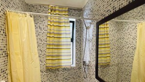 A bathroom with a shower, a sink, and a mirror. - Beautiful Studio In Casablanca (Casablanca)