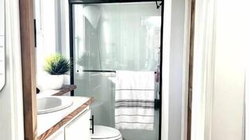 Shower, hair dryer, towels, soap