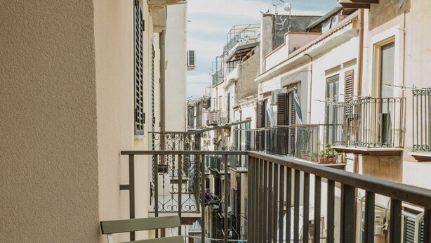 A narrow alleyway with a bench and a railing. - Art Home Collection by Wonderful Italy - Pop Studio (Cefalù)