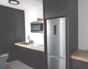 Fridge, microwave, stovetop, coffee/tea maker