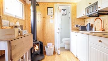 Fridge, electric kettle, toaster, cookware/dishes/utensils