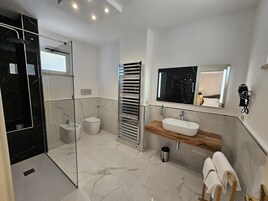 Suite | Bathroom | Hair dryer, bidet, towels, soap