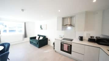 Premium Apartment | Living area | 50-inch Smart TV with cable channels
