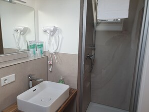 Hair dryer, towels, soap, shampoo