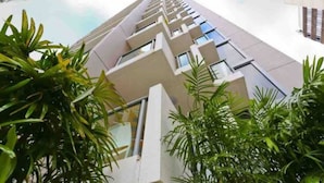 A modern high-rise building with a unique architectural design featuring a series of balconies and windows. - Urban Redefined - Centre of CBD (Brisbane City)