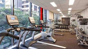 A gym with treadmills, elliptical machines, and weightlifting equipment. - Urban Redefined - Centre of CBD (Brisbane City)