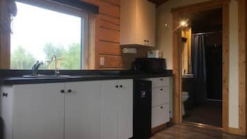 Fridge, electric kettle, toaster, dining tables