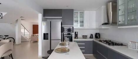 Fridge, microwave, oven, dining tables