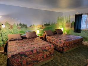 Habitación doble Deluxe | Edredón, camas con efecto memoria y decoración personalizada