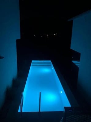 Seasonal outdoor pool, open 8:00 AM to 10:00 PM, pool umbrellas