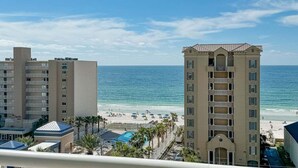 A beachfront hotel with a pool, beach view, and multiple balconies. - AMAZING CORNER UNIT, HUGE POOLS, BEACH VIEWS - Crystal Tower 809 (Gulf Shores)