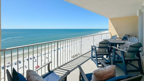 A balcony with a view of the beach and ocean. - BEACHFRONT, FAMILY FRIENDLY, OUTDOOR POOL, CLOSE TO RESTAURANTS (Gulf Shores)
