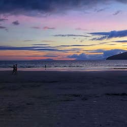 On the beach, white sand, sun-loungers, beach umbrellas