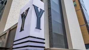 A building with a prominent 'NY' sign on its facade. - ymotel (Busan)