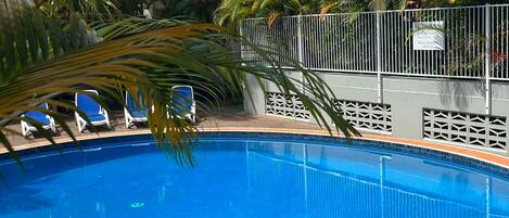 Outdoor pool, open 7:00 AM to 9:00 PM, pool loungers