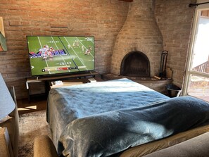 1 bedroom, desk, iron/ironing board, travel crib