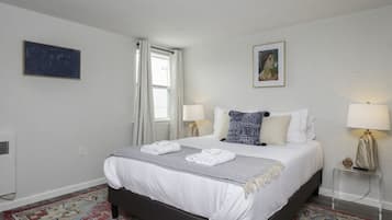 1 bedroom, desk, iron/ironing board, travel crib
