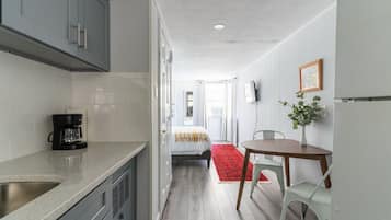 1 bedroom, desk, iron/ironing board, travel crib