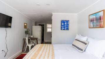 1 bedroom, desk, iron/ironing board, travel crib