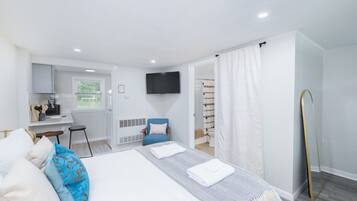 1 bedroom, desk, iron/ironing board, travel crib