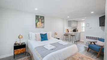 1 bedroom, desk, iron/ironing board, travel crib