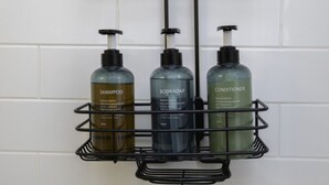 A bathroom shelf with three bottles of shampoo, body soap, and conditioner. - The Rossie Studio · Near Mystic, Casinos + USCGA (Groton)