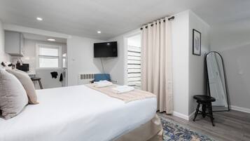 1 bedroom, desk, iron/ironing board, travel crib