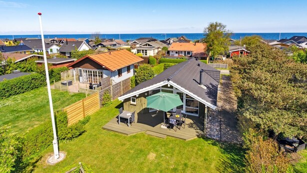 A residential area with houses, a flagpole, and a view of the sea. - "Hereth" - 100m from the sea by Interhome (Otterup)