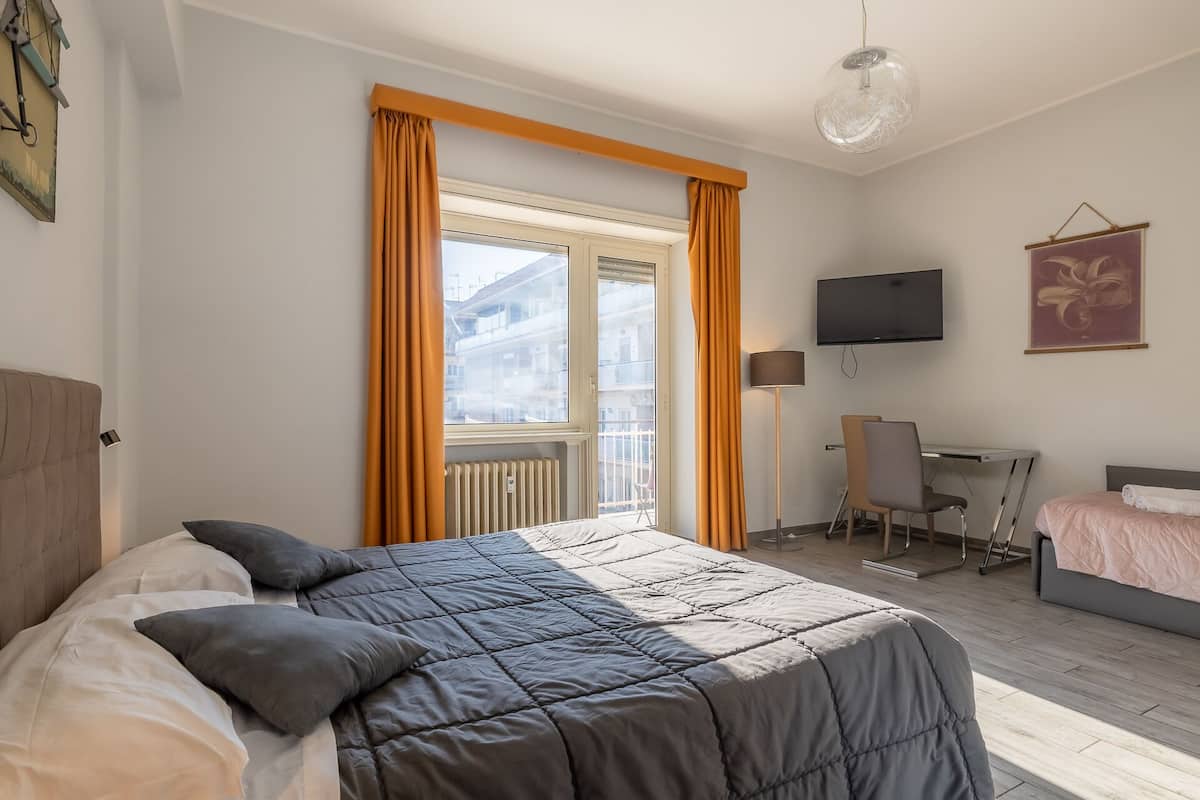 Deluxe Triple Room, Balcony | Desk, laptop workspace, iron/ironing board, free WiFi
