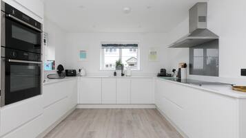 Fridge, electric kettle, toaster, cookware/dishes/utensils
