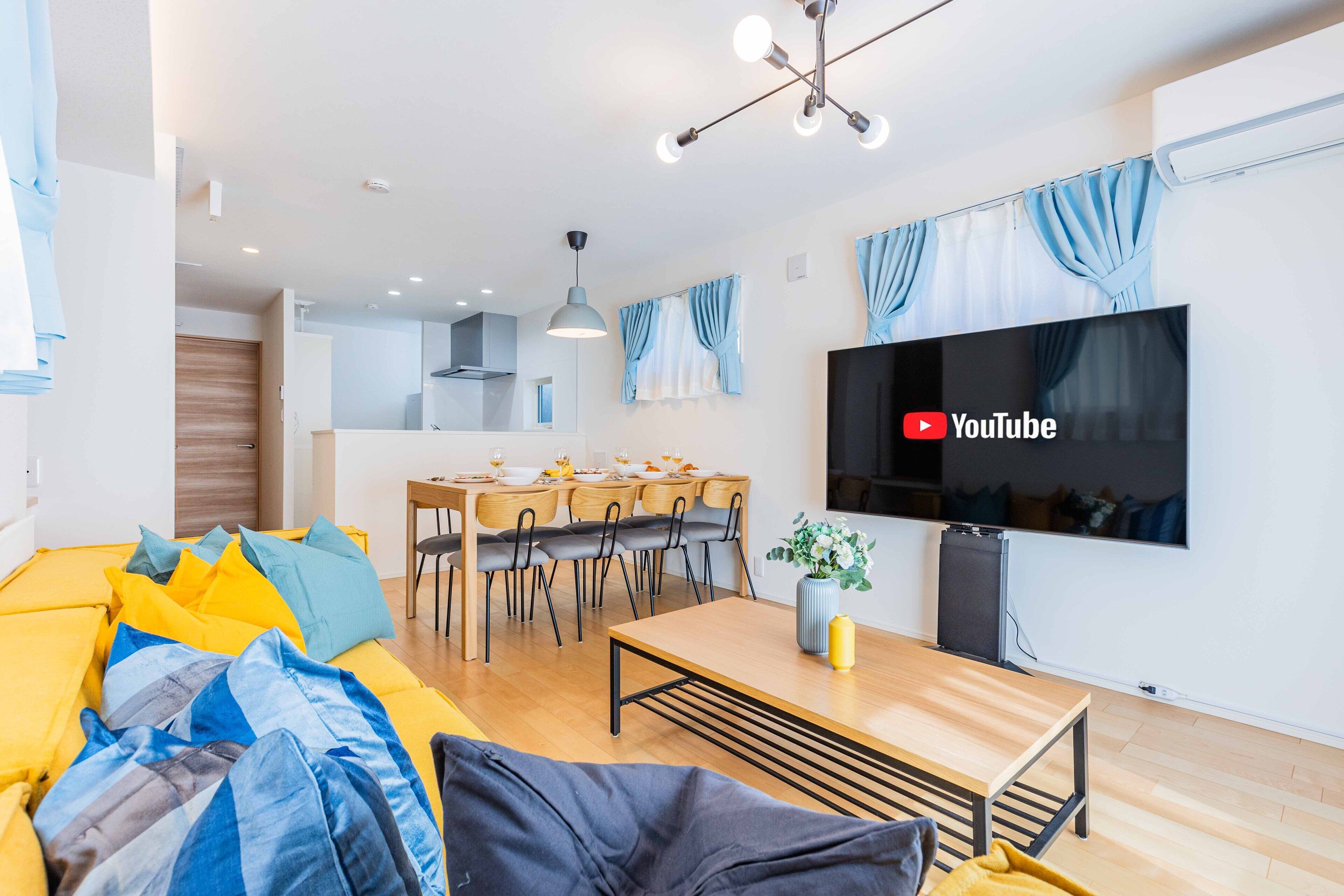 Executive House | Living area | 50-inch flat-screen TV with cable channels