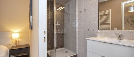 Shower, hair dryer, towels, soap