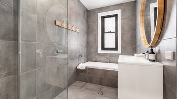 Shower, hair dryer, towels, shampoo