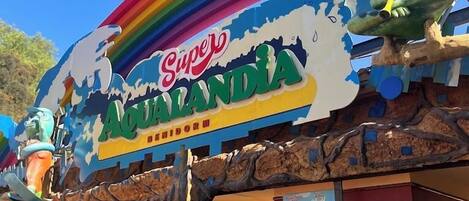 A colorful building with a sign reading "Super Aqualandia Bed & Breakfast".