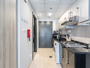 Fridge, microwave, stovetop, coffee/tea maker