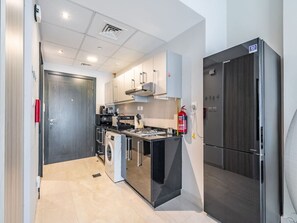 Fridge, microwave, stovetop, coffee/tea maker