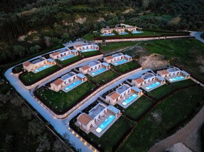 A large, modern residential complex with multiple houses, each featuring a private pool and well-maintained gardens. - Mega Lithari Villas Corfu (Corfu)