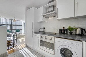 Apartamento | 2 dormitorios y tabla de planchar con plancha