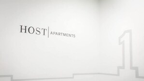 A wall with the text "HOST APARTMENTS" and a large number "1". - Host Apartments Fleet Nightlife III (Liverpool)