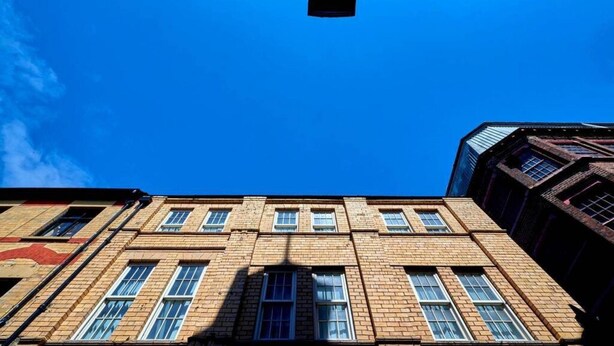 A multi-story building with a brick facade and multiple windows. - Host Apartments Fleet Nightlife III (Liverpool)