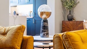 A modern living room with a round table, a decorative lamp, and a sofa. - Host Apartments Upper Duke Street Apartment (Liverpool)