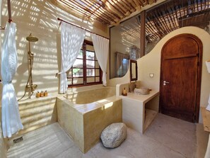 Premium Villa, Pool View | Bathroom | Bathtub, designer toiletries, hair dryer, slippers - Red Sands Mui Ne (Phan Thiet)