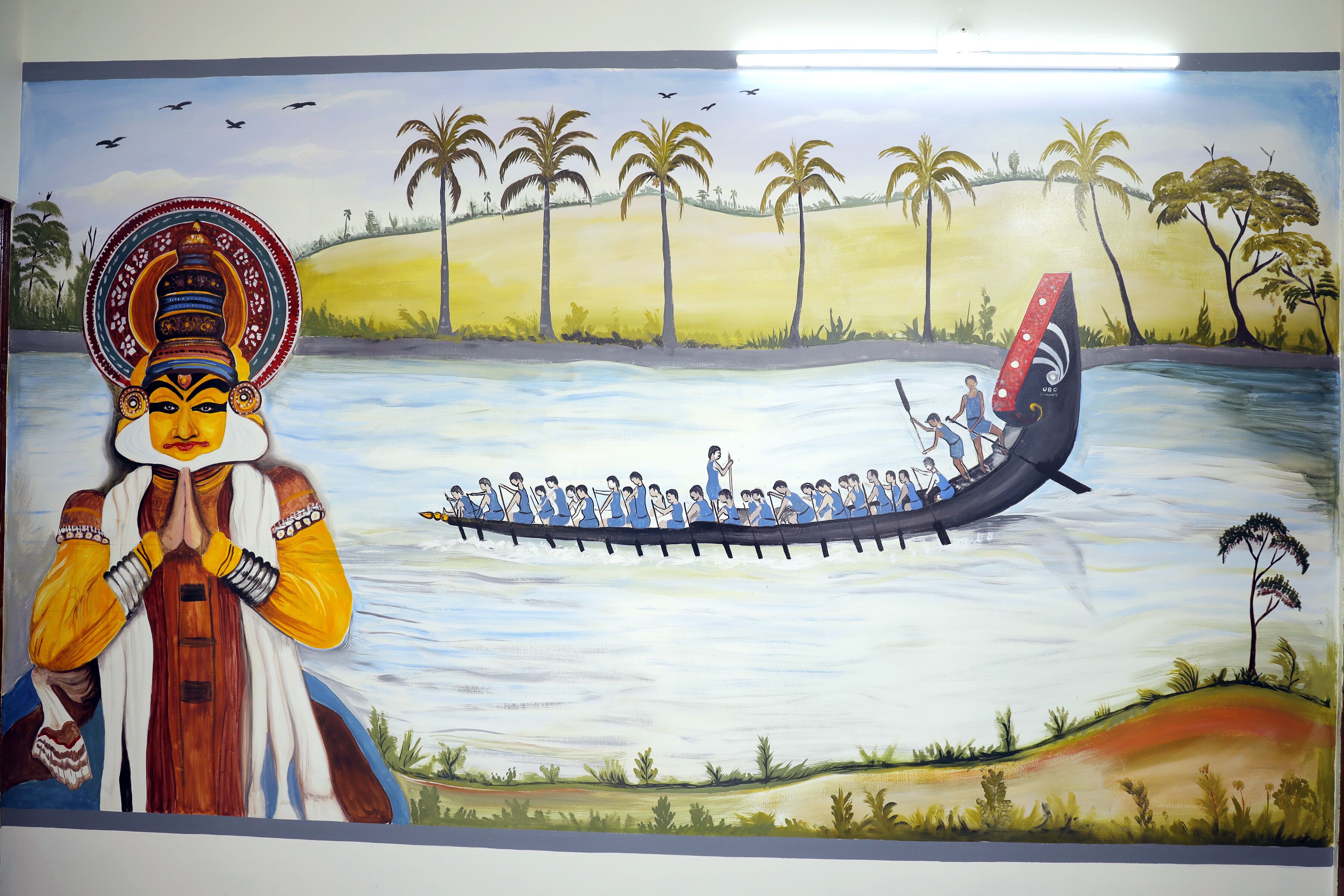 Un mural con una embarcación tradicional y una persona vestida con traje típico.