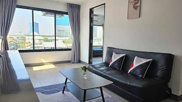 Exclusive Room, 1 Bedroom, Private Bathroom, City View | Living area | 24-inch Smart TV with digital channels