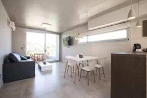 Apartment | Living area | Flat-screen TV, heated floors - Nova Pampa apart&spa (Mar Azul)