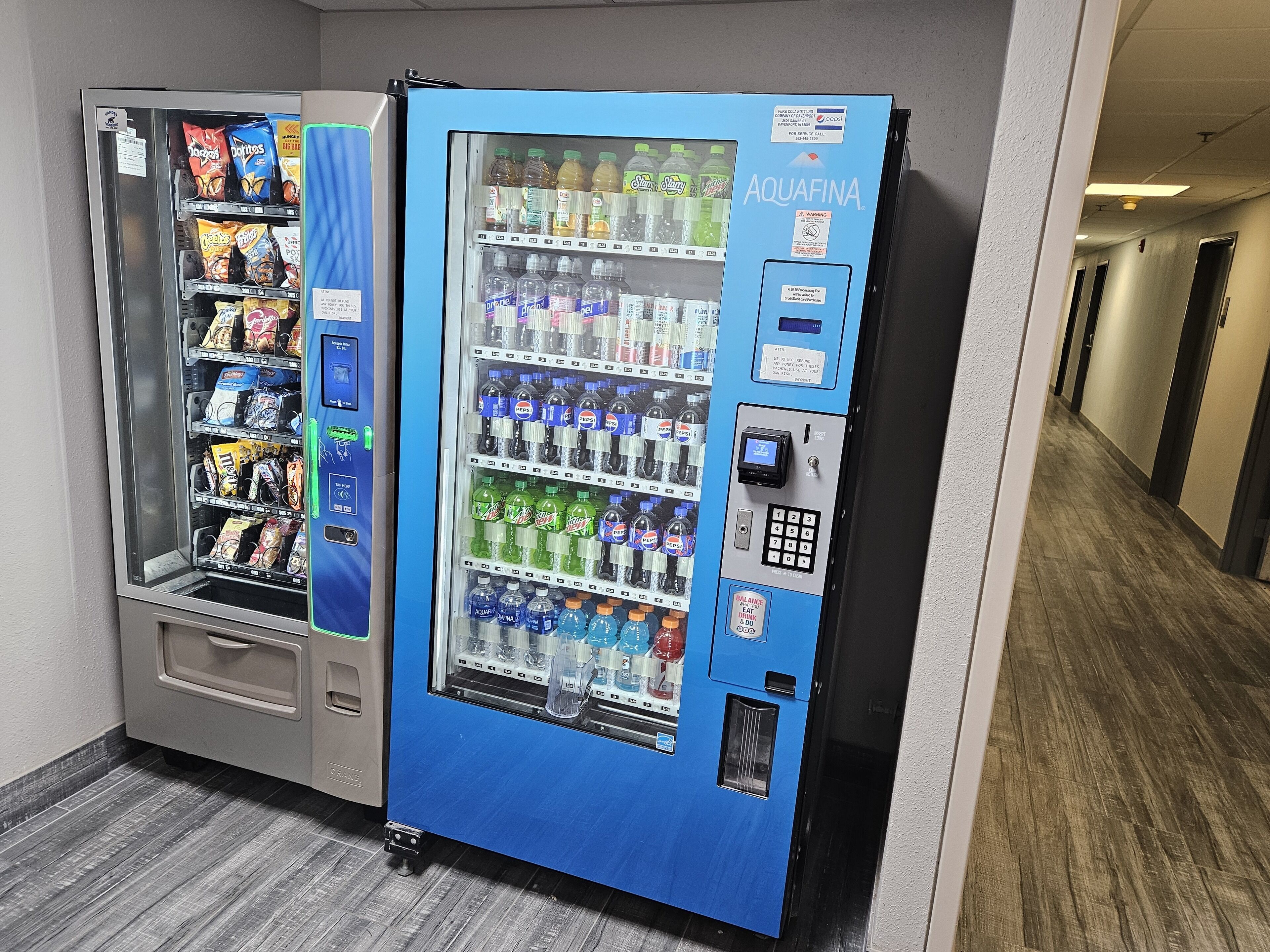 A vending machine with snacks and drinks, including Mountain Dew, Pepsi, and Aquafina water.
