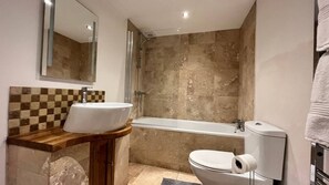 Business Apartment | Bathroom | Combined shower/tub, deep soaking tub, hair dryer, towels